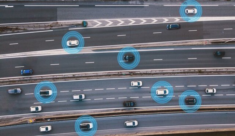 cars on a busy road, some with blue circles around them