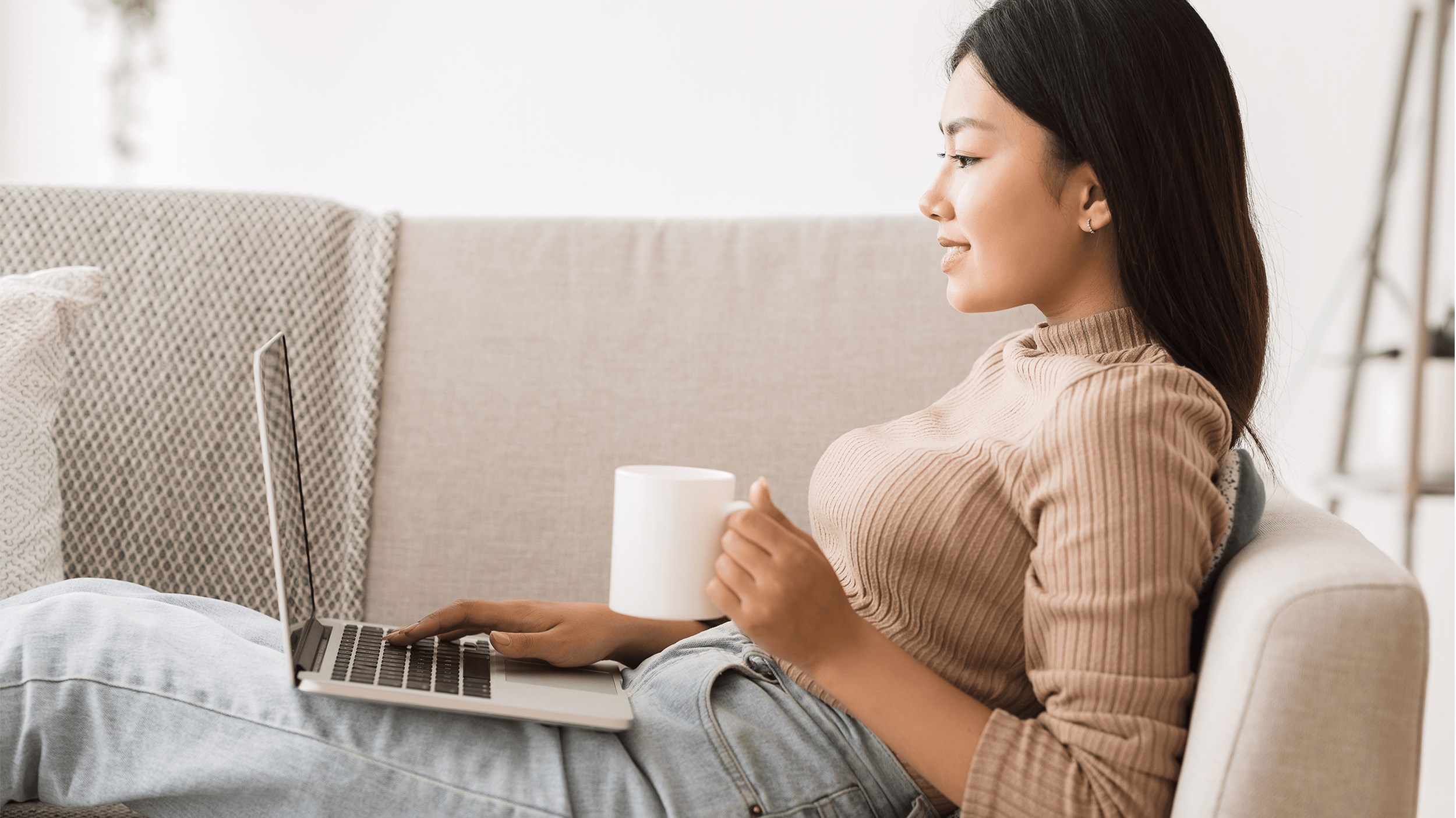 woman sitting down using social ecommerce