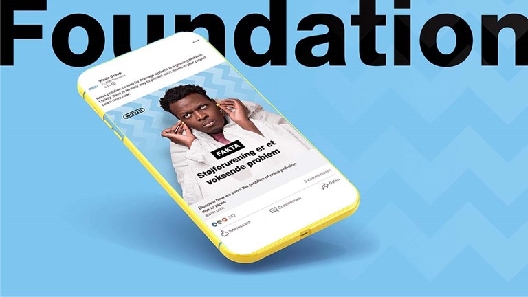 Yellow phone mockup on a blue background featuring Wavin social post with the headline "Foundation"