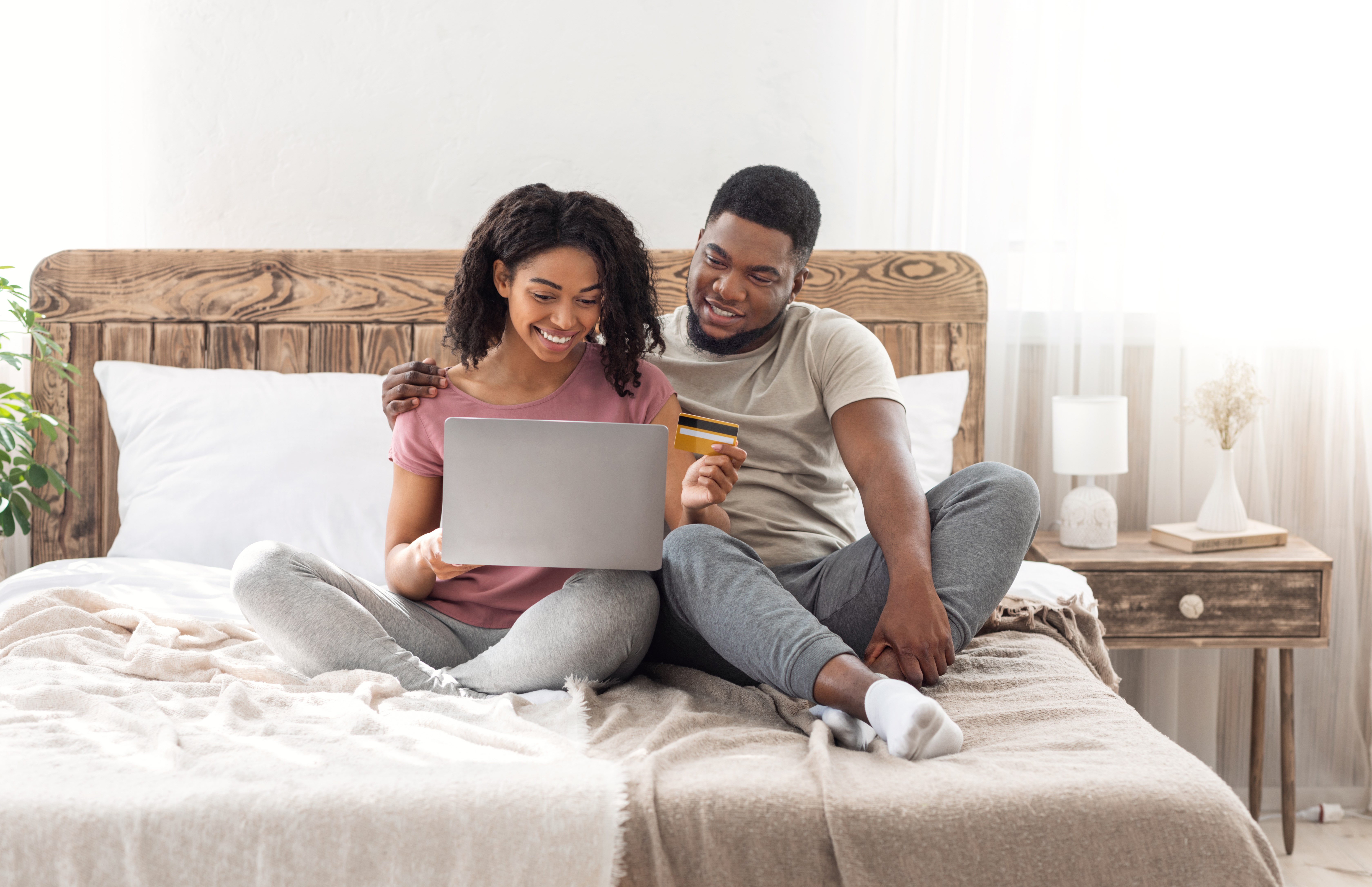 Happy man and woman shopping online