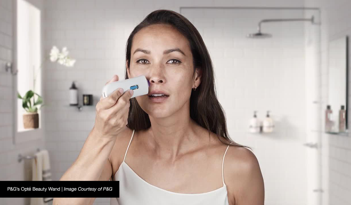 Woman using beauty tech Opte Wand