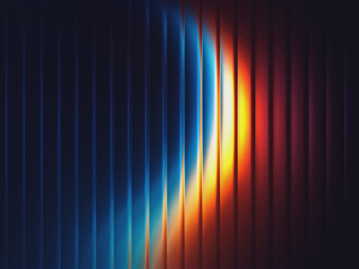 Abstract light arc in blue, orange and red sweeping across dark textured vertical ridges