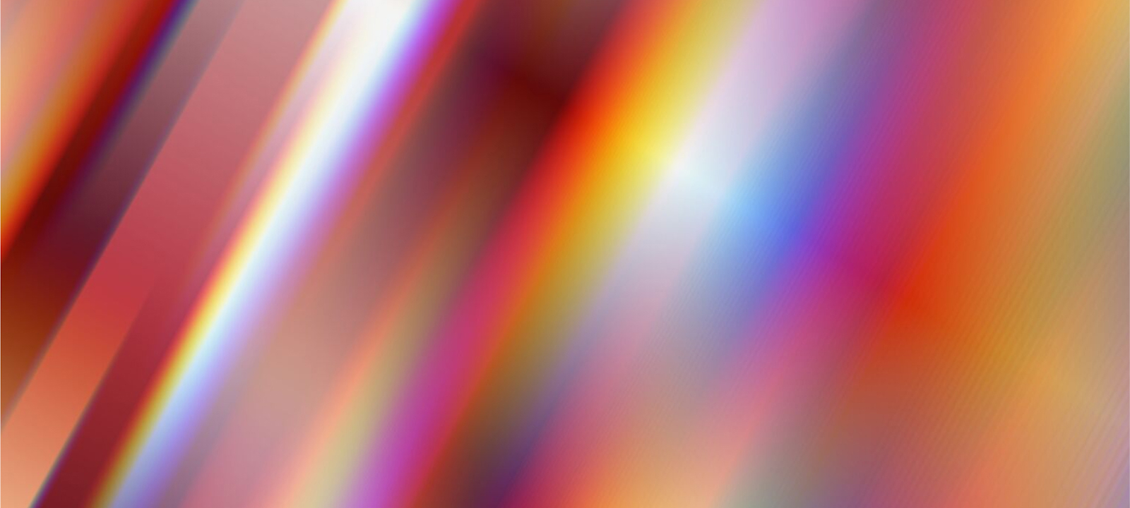 An abstract image featuring vibrant streaks of light in a range of colors, including red, orange, purple, and blue. The diagonal lines create a sense of motion and energy, blending smoothly into one another. The design has a futuristic and dynamic feel, representing creativity, innovation, or digital transformation.