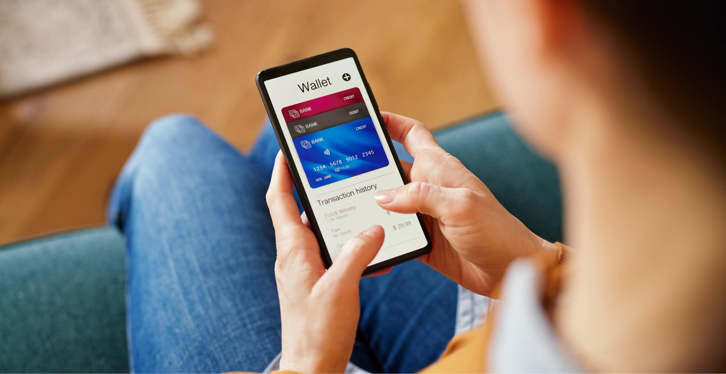 Woman using a smartphone digital wallet app for online transactions.