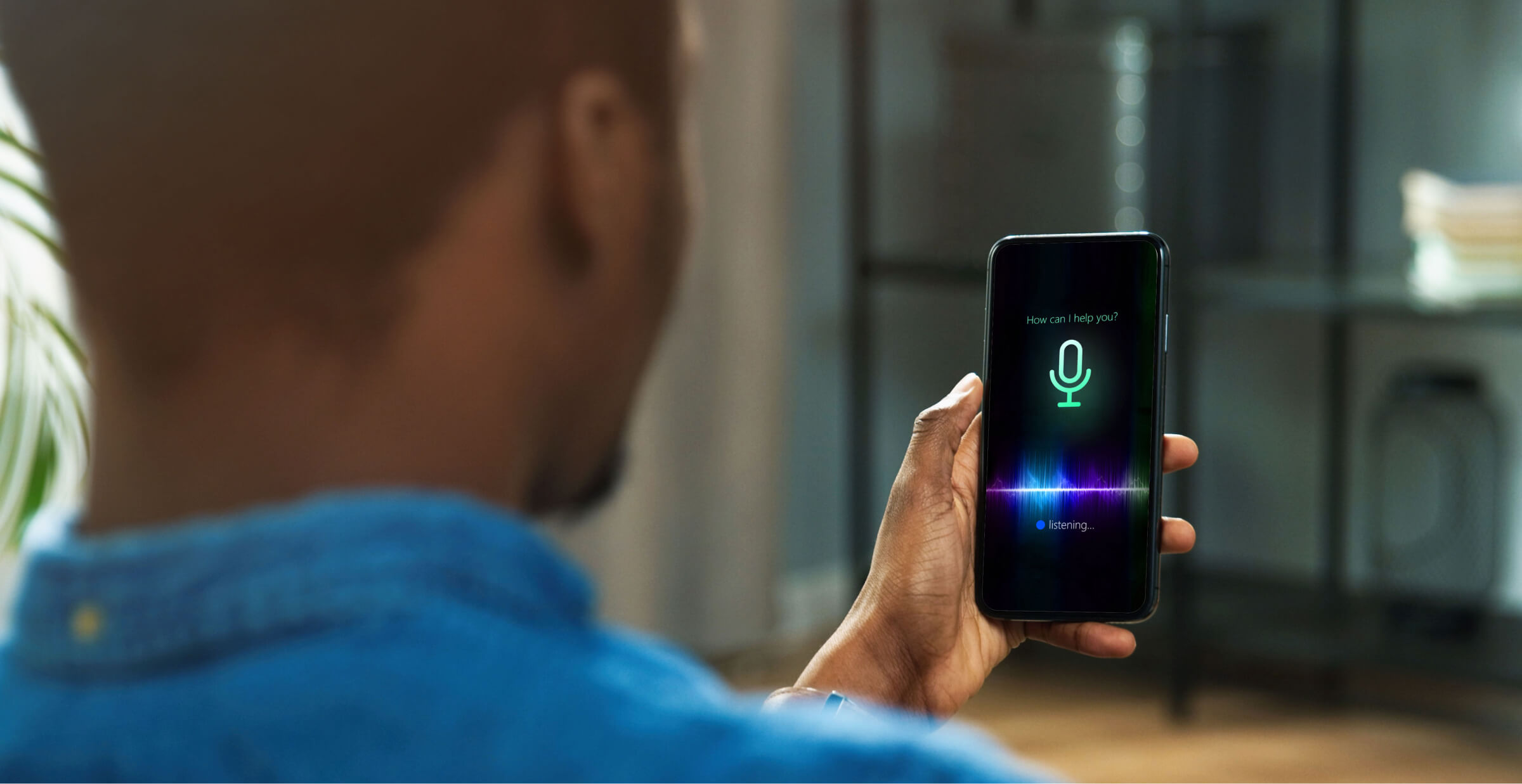 Man using AI smart voice assistant on a smartphone.