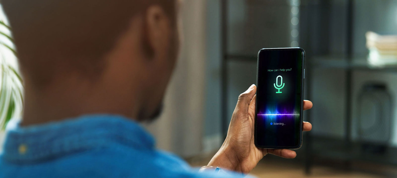 Man using AI smart voice assistant on a smartphone.