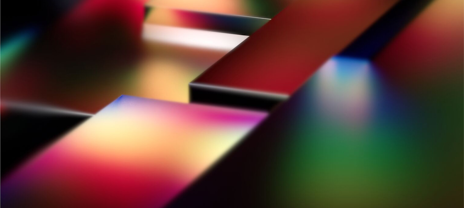 An abstract image featuring vibrant, multicolored 3D blocks with smooth surfaces and blurred edges. The colors blend seamlessly, creating a futuristic and dynamic composition. The blocks are arranged at varying angles, giving the image a sense of depth and movement. The design conveys innovation, creativity, and modernity, evoking themes of technology and digital transformation.
