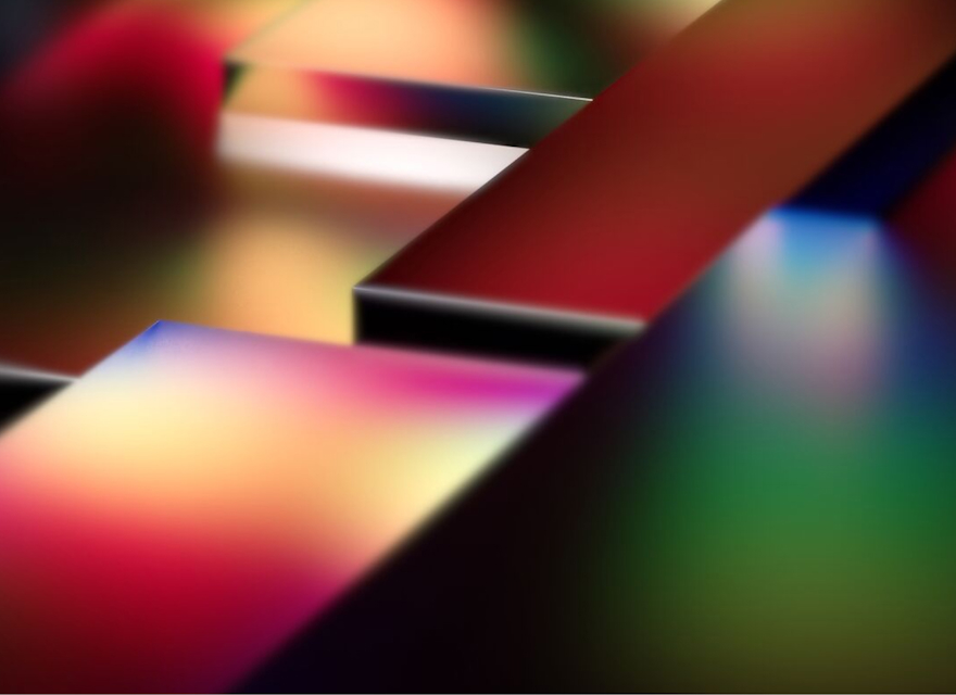 An abstract image featuring vibrant, multicolored 3D blocks with smooth surfaces and blurred edges. The colors blend seamlessly, creating a futuristic and dynamic composition. The blocks are arranged at varying angles, giving the image a sense of depth and movement. The design conveys innovation, creativity, and modernity, evoking themes of technology and digital transformation.