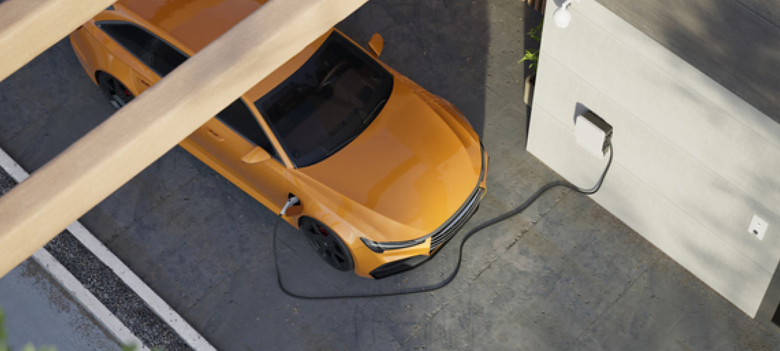 A top-down view of an orange electric car charging at a home charging station. The car is parked in a driveway, connected to a wall-mounted charging unit. The setting is modern and clean, with part of the car shaded by a wooden structure. The image highlights sustainability and the use of electric vehicles in residential environments.