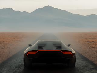 A sleek futuristic car speeds along a barren desert road under a clear blue sky.