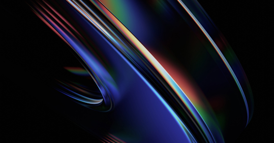 An abstract image featuring sleek, curved shapes with a glossy, reflective surface. The colors transition between deep blues, purples, and hints of red, green, and yellow, creating a dynamic, flowing composition. The dark background contrasts with the vibrant highlights, giving the image a futuristic and high-tech feel. The smooth, layered shapes evoke a sense of motion and depth, symbolizing innovation and the complexity of technology