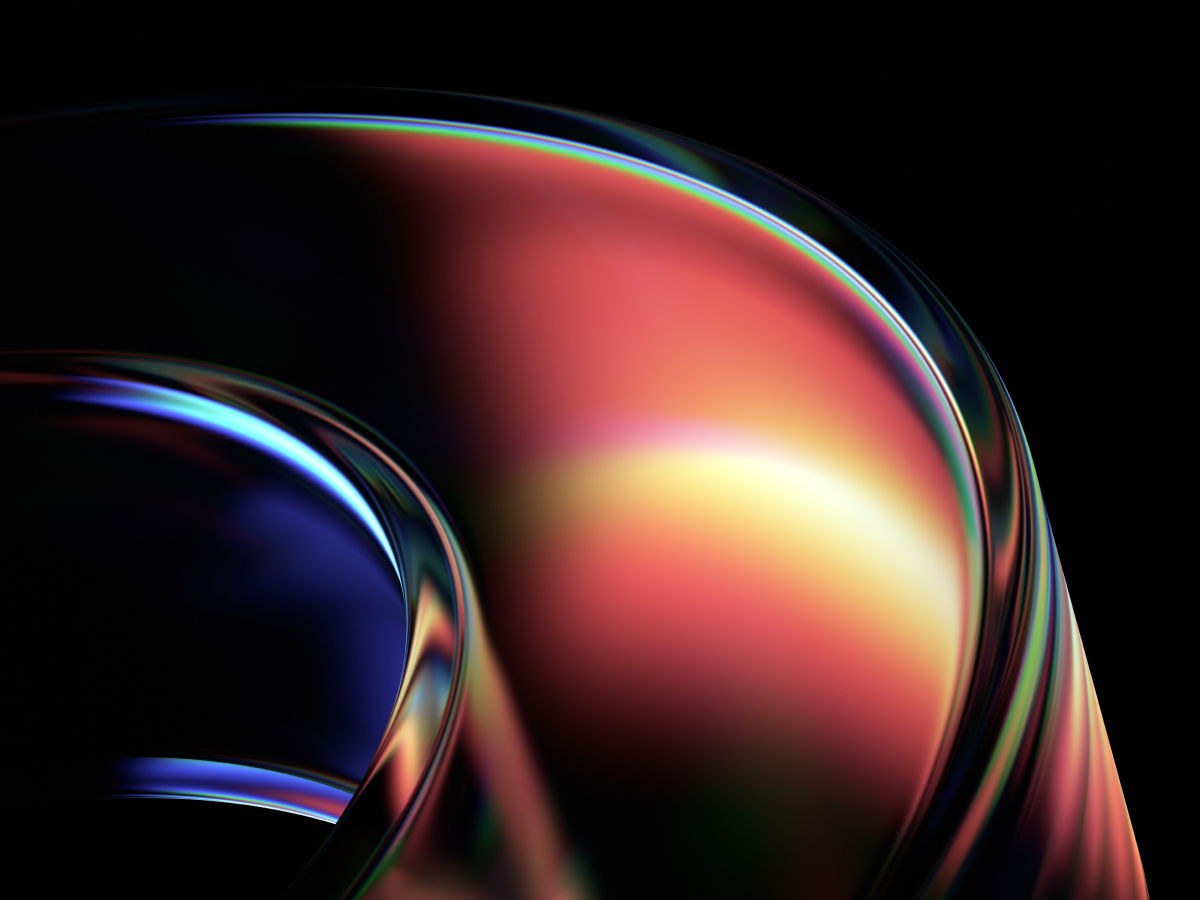An abstract image featuring smooth, curved shapes with a glossy, reflective surface. The design transitions from rich, deep blues on the left to warm reds, oranges, and yellows on the right, creating a sense of fluid motion. The light highlights and reflections give the shapes a futuristic and dynamic feel, with the dark background adding depth and contrast. The combination of vibrant colors and sleek curves evokes innovation and cutting-edge technology.