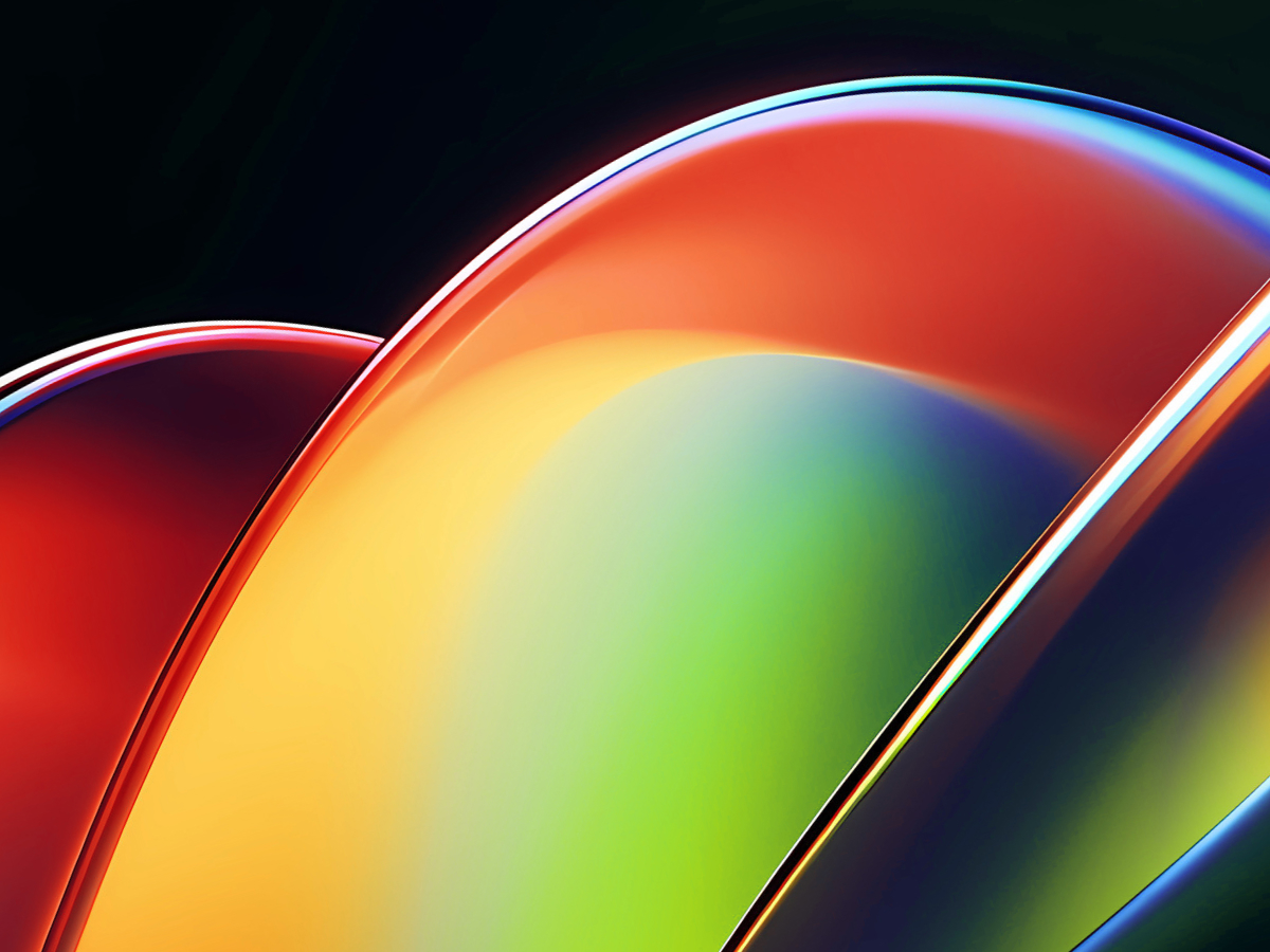 An abstract image featuring smooth, overlapping curved shapes with glossy, reflective surfaces. The colors transition from vibrant reds and oranges on the left to bright yellows, greens, and deep blues on the right. The design creates a sense of fluidity and motion, with the light reflecting off the curves to emphasize their sleek, polished appearance. The dark background enhances the bright, bold colors, giving the image a modern and dynamic feel, often associated with technology and innovation.