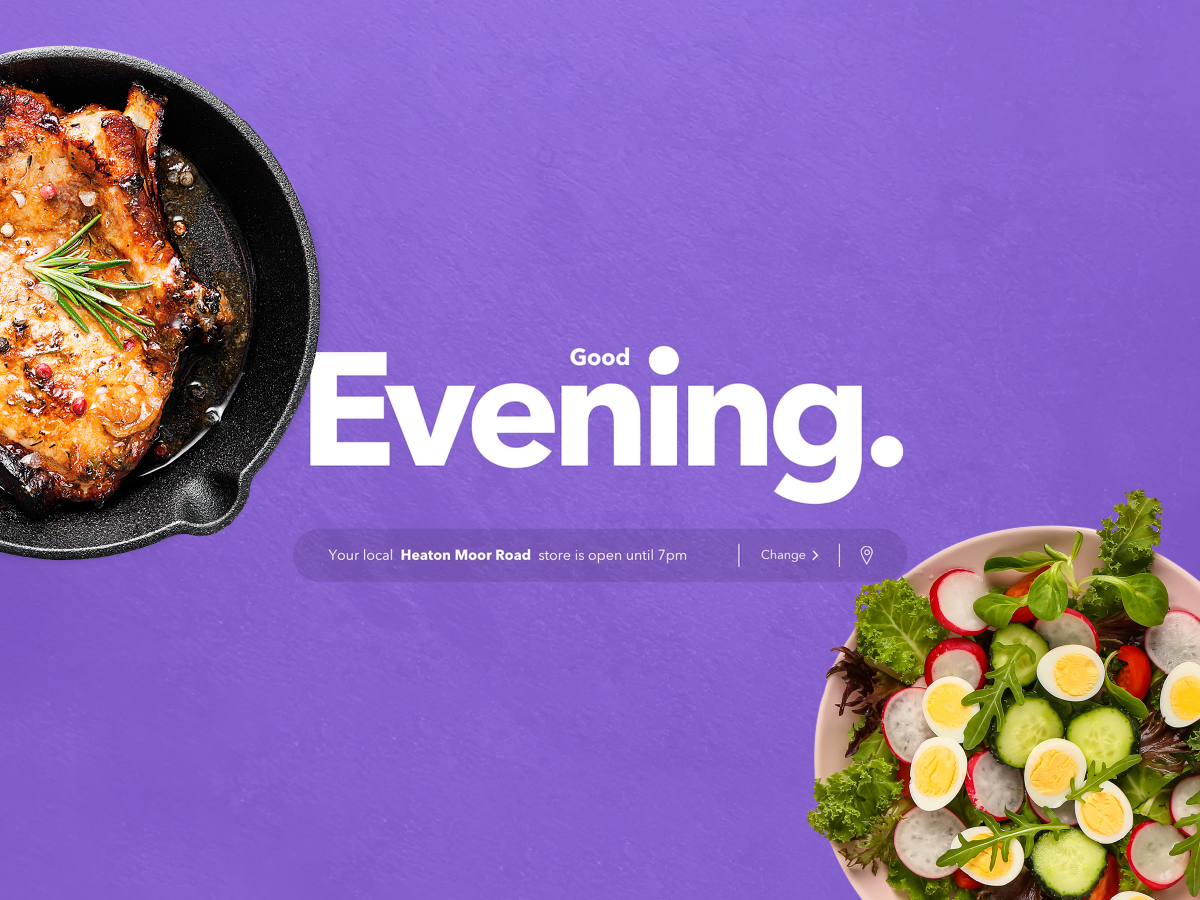 A vibrant image with a purple background featuring the text 'Good Evening.' On the left side is a skillet with a perfectly cooked, seasoned meat dish, and on the right is a fresh salad with sliced vegetables and boiled eggs. Below the text, there is a message indicating that the local Heaton Moor Road store is open until 7 pm, with an option to change the location