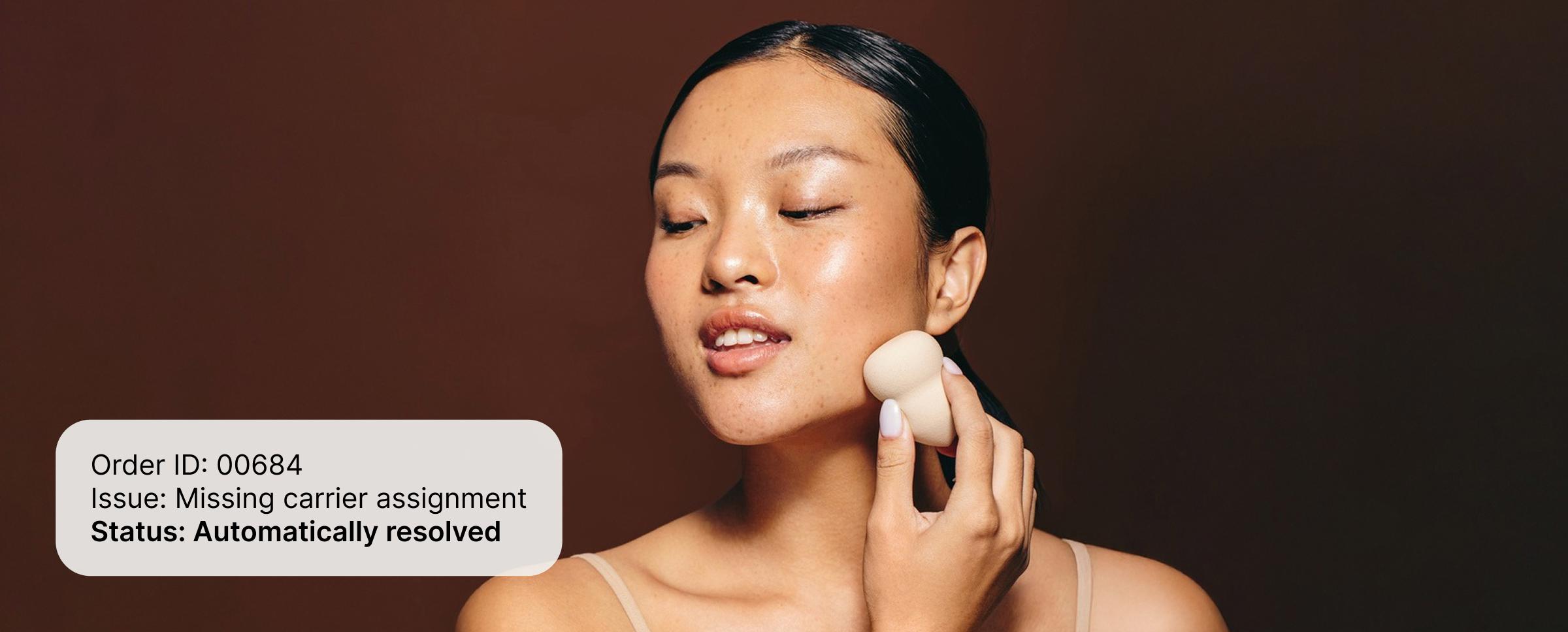 Person applying makeup sponge to jawline with overlay showing order issue automatically resolved.