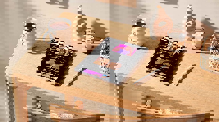 Mockup scene of a tablet on a light wood desk featuring Pandora Me page