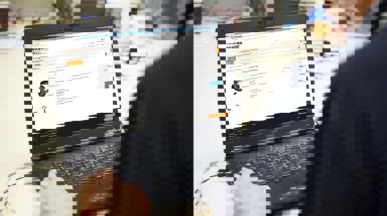 View of a man browsing a Vanderlande Spare Parts page