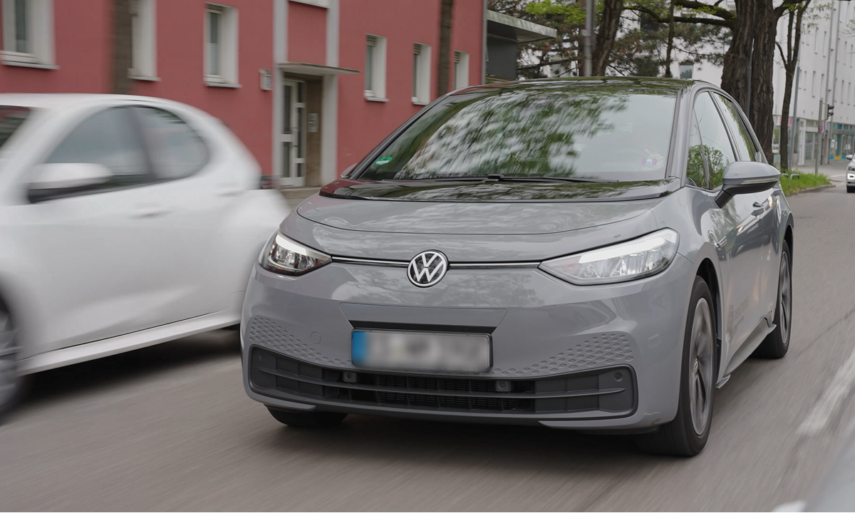 Volkswagen i-motion electric car parked, showcasing its sleek design and modern features in a bright urban setting.