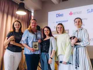 Five females standing next to each other posing with Valtech's earned Veteran Friendly Award from Veteran Hub