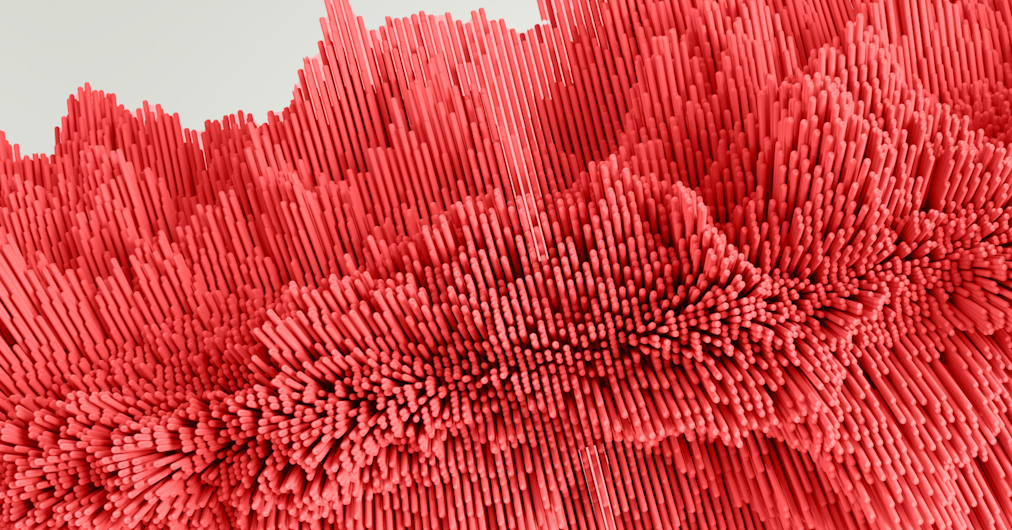 close-up of an abstract design featuring numerous red vertical bars of varying heights, arranged in a pattern resembling waves or undulating terrain