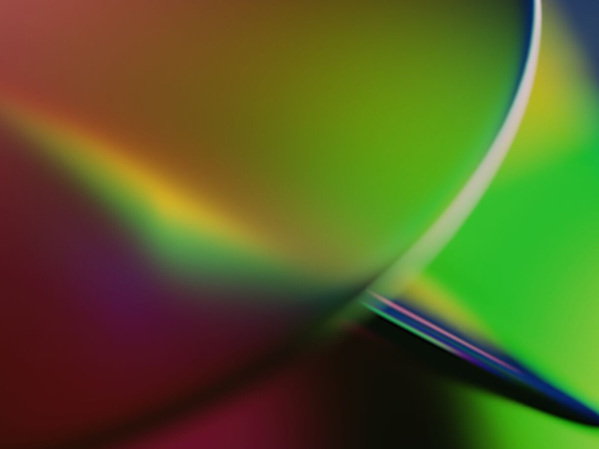 Abstract composition of vibrant gradient colors with curved light reflections, representing digital acceleration, innovation, and emerging technologies.